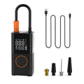Portable mini self-propelled electric tire inflator pump and handheld wireless charging.