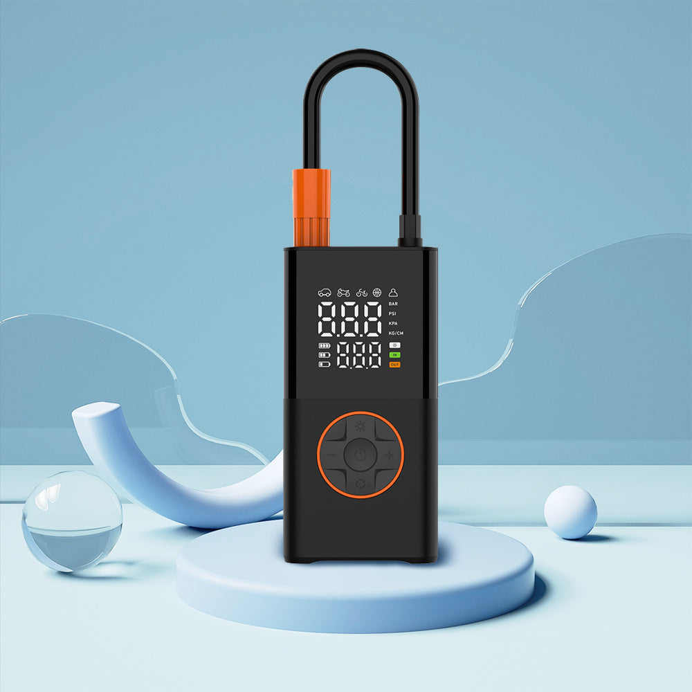 Portable mini self-propelled electric tire inflator pump and handheld wireless charging.